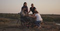 Wheelchaired soldier being together with family