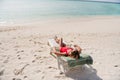 Full size above view photo of beautiful lady lying lounge chair azure water exotic resort empty desert beach no people Royalty Free Stock Photo