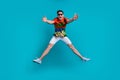 Full size body photo of careless jumping up opened hands missing you guy have fun tropical print shirt isolated on blue