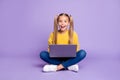 Full size photo of amazed child sit folded crossed legs work computer get social media notification scream wow omg wear Royalty Free Stock Photo