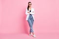 Full size photo of attractive businesswoman folded arms wear white jacket jeans isolated on pink color background Royalty Free Stock Photo