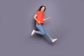 Full size photo of cheerful candid girl teen jump imagine she rock star play guitar sing song wear good looking clothing