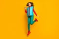 Full size photo of cheerful cute girl jump use cellphone social media repost sales news wear red blue green pants