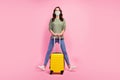 Full size photo of cheerful lovely cute traveler tourist girl hold suitcase enjoy traveling covid quarantine wear