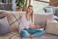 Full size photo of clever young blond lady sit working laptop wear shirt jeans at home on weekend vacation alone Royalty Free Stock Photo