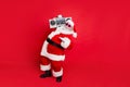 Full size photo of cool old stylish trendy santa claus in eyewear eyeglasses dancing holding audio sound cassette