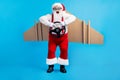 Full size photo crazy white grey hair bearded santa claus fly race steering wheel wings x-mas eve time party travel wear Royalty Free Stock Photo