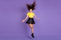 Full size photo of energetic cute girl jump wear t-shirt skirt boots isolated on lilac background