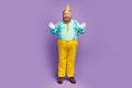 Full size photo of excited cheerful fat man pull his pink suspenders enjoy anniversary party celebration wear cone Royalty Free Stock Photo