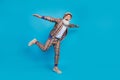 Full size photo of excited funny granddad stand one leg arms wings isolated on blue color background