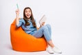 Full size photo of excited surprised girl work on her project have brilliant idea what write hold note book sit on big
