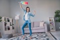 Full size photo of funky brunette young lady dance clean brush wear jeans shirt at home alone Royalty Free Stock Photo