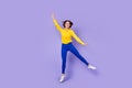 Full size photo of funky millennial lady jump wear wear smart casual isolated on violet background