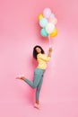 Full size photo of funky positive cheerful brunette wavy curly hair african girl hold many colorful balons enjoy event 8