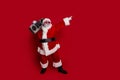 Full size photo of funny body positive santa listen boom box index promo wear hat eyewear coat pants boots isolated on
