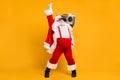 Full size photo of funny overweight christmas white beard hair grandfather hold retro boombox show v-signs have fun on x