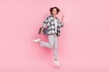Full size photo of funny young brunette lady jump hold laptop wear shirt trousers shoes isolated on pink background Royalty Free Stock Photo
