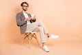 Full size photo of handsome charismatic businessman having break drinking coffee isolated on beige color background Royalty Free Stock Photo