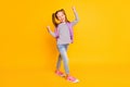 Full size photo of happy excited schoolgirl child kid wear purple backpack on yellow color background