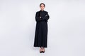 Full size photo of happy good mood positive woman judge with folded hands in black robe isolated on white color