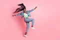 Full size photo of laughing crazy lady dancing fooling around enjoy her hobby isolated on pink color background