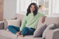 Full size photo of nice afro american woman sit sofa good mood weekend at home rest indoors inside house