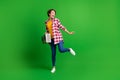 Full size photo of nice funky lady dancing hold boombox wear jeans shirt sneakers isolated on green background