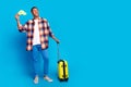 Full size photo of nice young man suitcase taxi ad empty space wear shirt  on blue color background Royalty Free Stock Photo