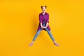 Full size photo of pretty funky crazy excited teen lady jump up good mood rejoicing spread legs summer weekend wear Royalty Free Stock Photo