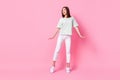 Full size photo of pretty positive girl striped t-shirt white pants shoes interested looking empty space isolated on