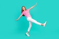 Full size photo of pretty teenager girl falling down fly walk dressed stylish pink print outfit on aquamarine