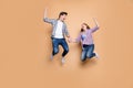 Full size photo of two people crazy lady guy jumping high celebrating best win raising fists sale shopping holding hands