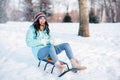 Full size photo of young funky funny pretty smiling excited crazy woman riding fast speed on sledge having fun winter