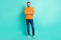 Full size photo of young handsome cheerful positive confident businessman with folded arms isolated on turquoise color Royalty Free Stock Photo