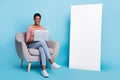 Full size photo of young man woman poster banner sit chair use laptop manager project isolated over blue color Royalty Free Stock Photo