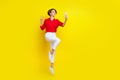 Full size portrait of energetic attractive girl jump demonstrate v-sign make selfie isolated on yellow color background Royalty Free Stock Photo