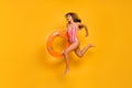 Full size profile photo of beautiful lady beach pool jumping into water lifeguard carry orange buoy save drowning person Royalty Free Stock Photo