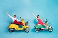 Full size profile photo of crazy lady guy couple drive two retro moped travelers traffic jam easy way spread legs raise Royalty Free Stock Photo