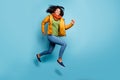 Full size profile photo of dark skin curly lady jumping high rushing discounts shopping wear overcoat jeans green