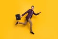 Full size profile photo of handsome stylish business guy jump high up rushing work office hold briefcase wear plaid Royalty Free Stock Photo