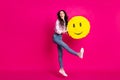 Full size profile photo of optimistic brunette nice lady jump hold pinata wear jacket jeans sneakers isolated on pink