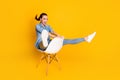 Full size profile side photo of energetic crazy girl sit chair imagine she ride mountain rider fast speed wear good look Royalty Free Stock Photo