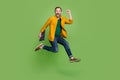 Full size profile side photo of mature business man happy positive smile jump up hold laptop  over green color Royalty Free Stock Photo