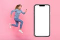 Full size profile side photo of young excited girl run energetic look empty space hurry isolated over pink color