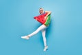 Full size profile side photo of young girl happy positive smile hold big watermelon slice fruit isolated over blue color