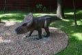 Full-size statue of protoceratops in the forest