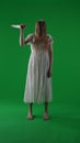 Full-size vertical green screen, chroma key shot of a posessed female, woman figure, ghost, poltergeist, zombie raising