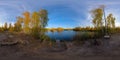 Full spherical 360 by 180 degrees panorama of evening autumnal lake with birch forest on its shores