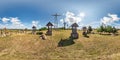 Full spherical seamless hdri panorama 360 degrees angle view on gravel road near mountain of crosses monument on hill in