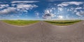 Full spherical seamless hdri panorama 360 degrees angle view on no traffic asphalt road among fields with clear blue sky and